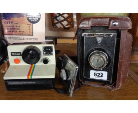 A vintage Polaroid Land Camera - sold with an old Shanghai box camera and detachable handle