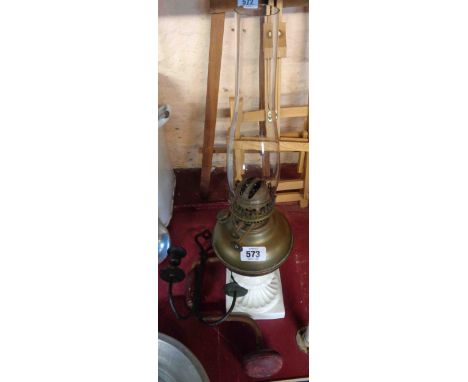 A vintage ceramic and glass oil lamp - sold with a candle wall sconce and an old hand drill