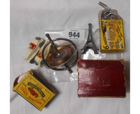 An Eiffel Tower spinning top toy - sold with two Lesney Yesteryear model vintage cars and a boxed matchbox nickel-plated wire