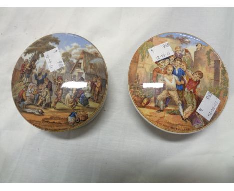 Two 19th Century Prattware jars with typical transfer printed lids, 'The Village Wedding' and 'The Wolf and the Lamb'