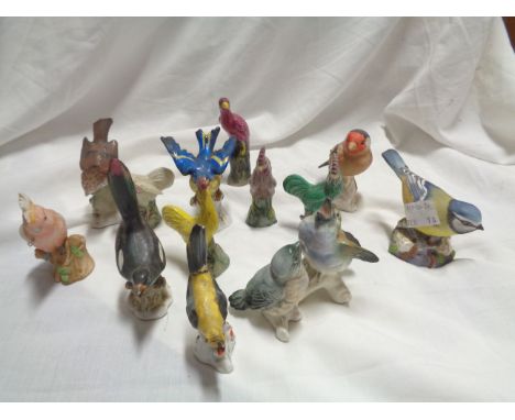 A small quantity of ceramic bird figurines including Royal Worcester Blue Tit, etc.