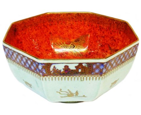 A large Wedgwood butterfly lustre bowl of octagonal form with gilt motifs and a chinoiserie border on a light green ground to