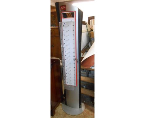 A tall vintage Ray-Ban sunglasses display stand