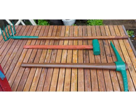 A pick, fork and hammer with later painted green finish