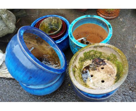 Six blue planters - sold with a red planter and one other