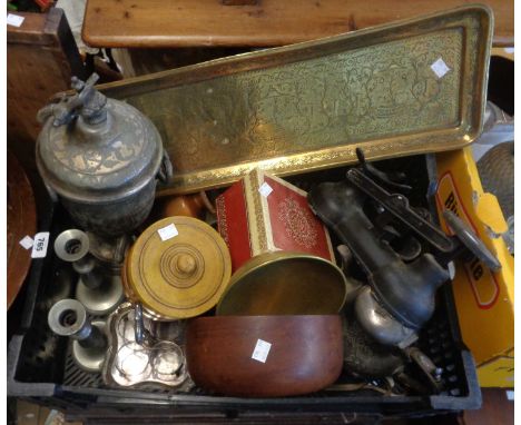 A crate containing a quantity of pewter and other metal items including a decorative brass tray, a set of weighing scales, et