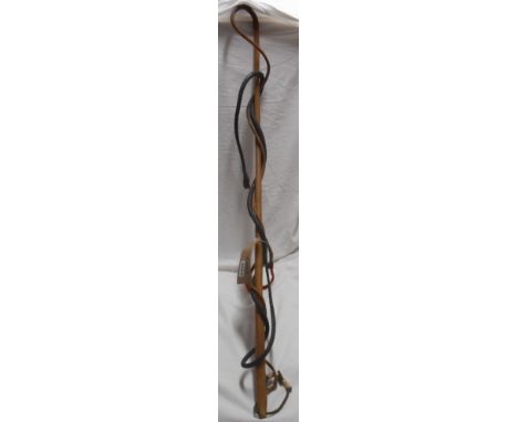 An old African animal hide whip - sold with another similar bound leather whip