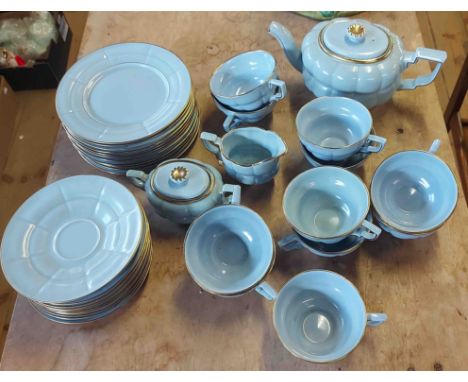 A vintage Gefle Sweden part tea set of lobed form with light blue glaze finish including eleven teacups and saucers, teapot, 