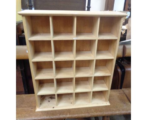 A 61cm modern blondewood spice rack with twenty square sections