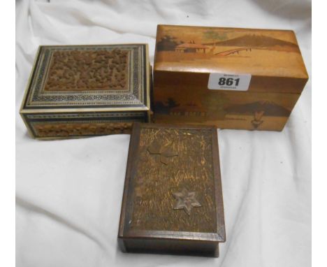A vintage Oriental cigarette box - sold with two other decorative boxes and a faux tortoiseshell lidded box
