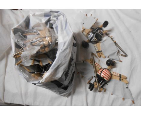 A bag containing a quantity of vintage style wooden suspension figurines