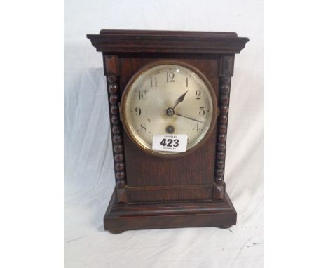 A vintage polished oak cased table timepiece with Junghans mechanical movement