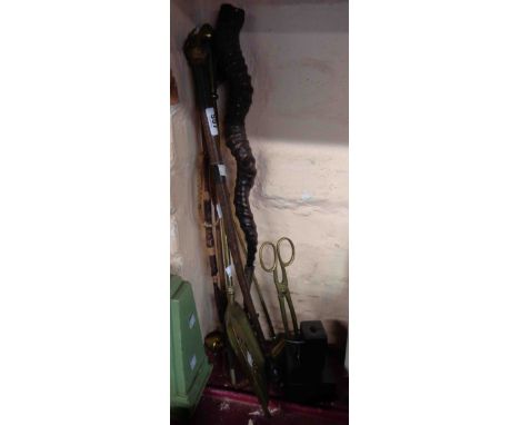A quantity of collectable items including fire irons, riding crops and an antelope horn toasting fork