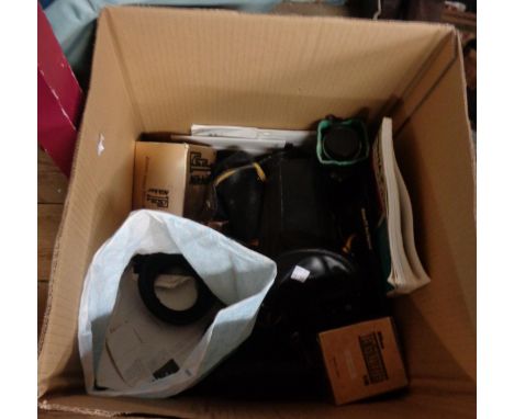 A box containing Nikon, Pentax and other camera lenses