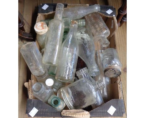 A box containing a quantity of vintage bottles