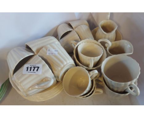 A quantity of Spode teaware in the Chelsea Wicker pattern comprising eight tea and coffee cups with saucers, a cream and suga