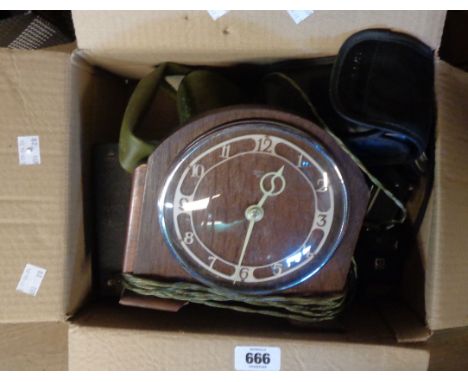 A box containing a quantity of vintage cameras - sold with a Smiths wooden cased mantel clock