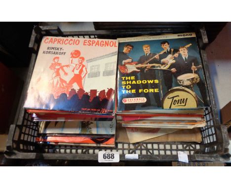 A collection of vintage 45rpm singles including The Shadows, etc.