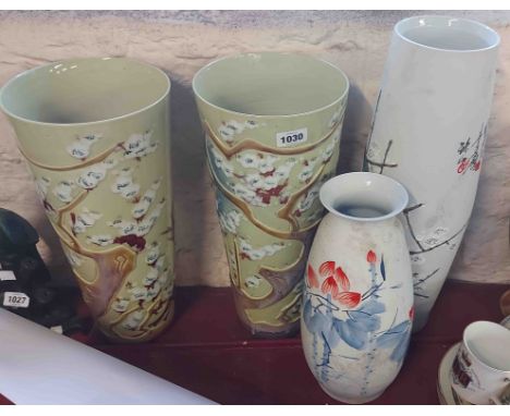 A pair of large 20th Century Chinese porcelain vases with moulded and hand painted enamel prunus decoration and calligraphic 