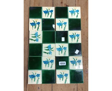 Six Victorian dust-pressed ceramic tiles, each decorated with floral motifs on a green and cream glaze ground - minor rim chi