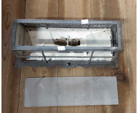 A metal wall light of cage form with glass panels - two panels missing