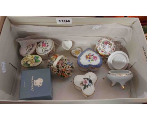 A box containing a quantity of ceramic trinket boxes of various form and maker