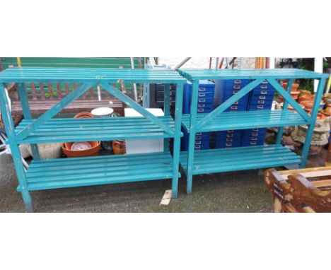 A pair of green slated wooden garden shelf units