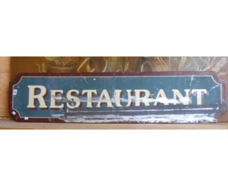 A vintage railway 'Restaurant' sign with gloss red border and shadowing to the white transfer letters on a green/blue ground 