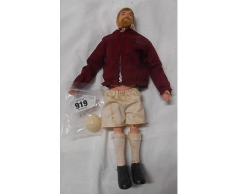A vintage Action Man footballer in earlier West Ham strip complete with original football