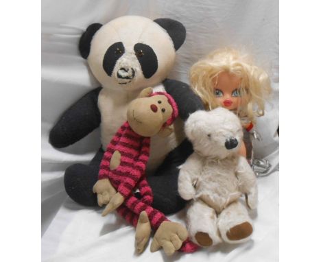 A bag containing two vintage Teddy bears and a doll