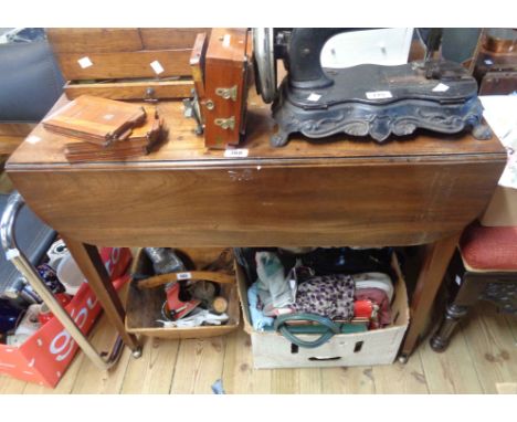 An 84cm 19th Century mahogany Pembroke table with blind drawer to one end, set on square tapered legs with brass caps and cas