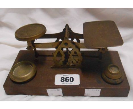 A set of antique wood and brass postal scales