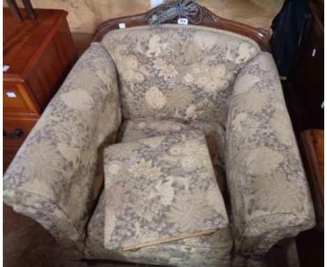 A 1920's style carved oak part show frame armchair with machine tapestry upholstery - sold with a matching footstool