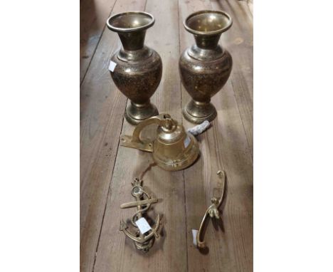A quantity of brassware consisting of two vases, a door knocker, porch bell and a brass monkey