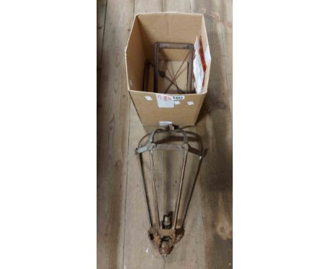 A box containing an old brass porch light of cage form with ram's head moulding and three feather base finial