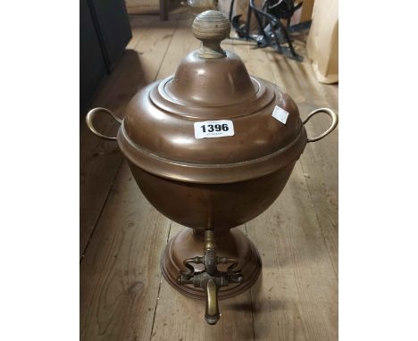 A old copper samovar with brass tap and wooden finial