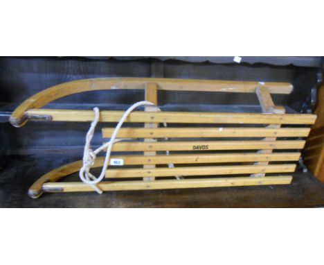 A vintage wooden sledge marked Davos