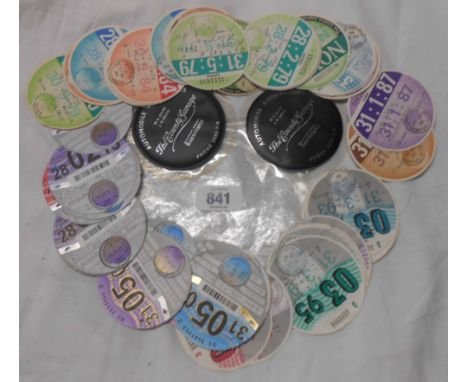 A quantity of vintage vehicle road tax disks dating 1967 onwards
