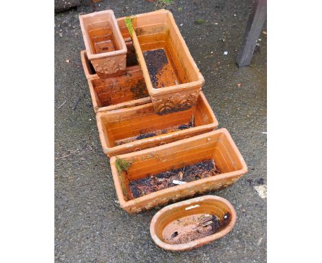 Six rectangular planters - sold with one smaller similar and a circular planter