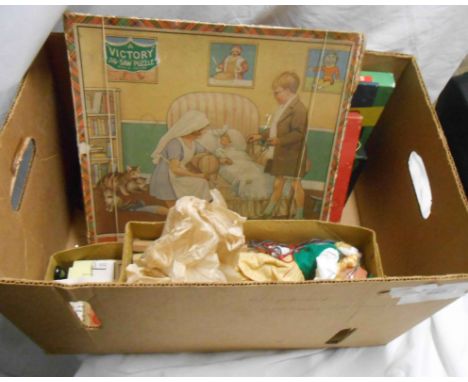 A box containing a quantity of vintage games, a victory puzzle, a Pelham puppet and one other