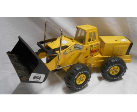 A vintage yellow Tonka toy digger truck