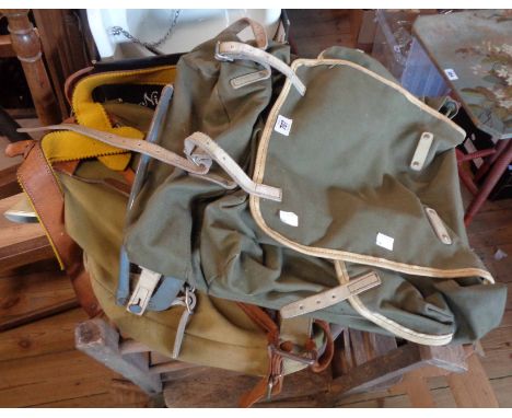 Two vintage canvas and leather rucksacks
