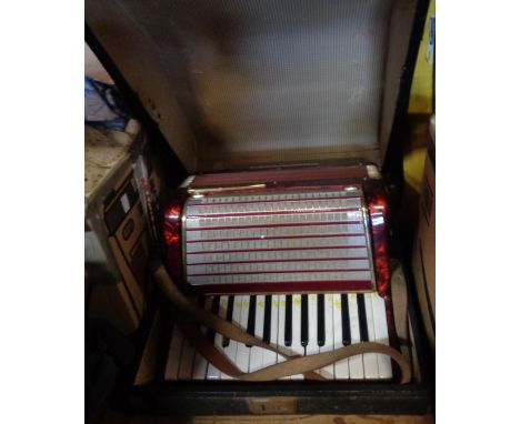 A cased Worldmaster 32 bass accordion