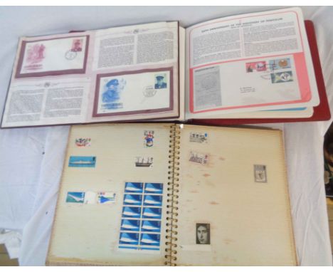 A stamp album containing British pre-decimal and decimal stamps, Postal Heritage Society of British Commonwealth FDCs and an 