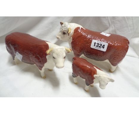 A Beswick pottery Hereford Champion of Champions cattle family comprising bull, cow and calf