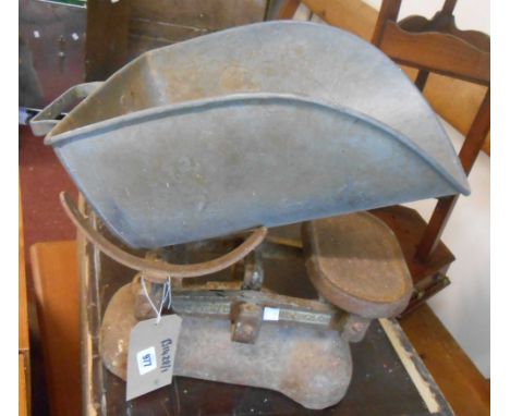 A vintage spring balance - sold with an old set of W.T. Avery shop scales and weights