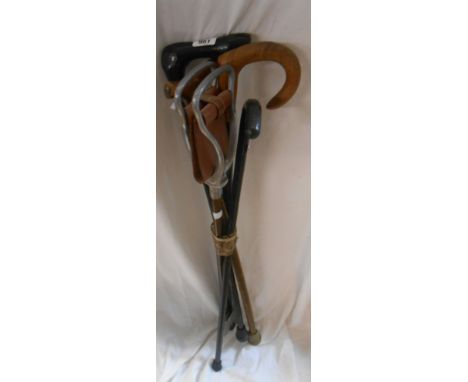 Four vintage wooden walking sticks - sold with a shooting stick