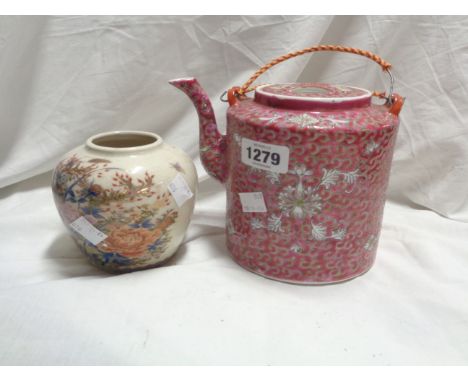 A 20th Century Chinese porcelain teapot and cover with all-over red enamel decoration - sold with a small ginger jar