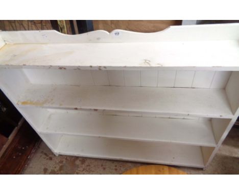 A 1.16m old white painted pine four shelf open bookcase