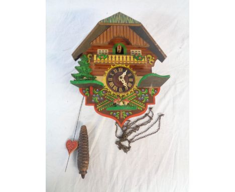 A tourist ware cuckoo wall clock with single weight driven movement